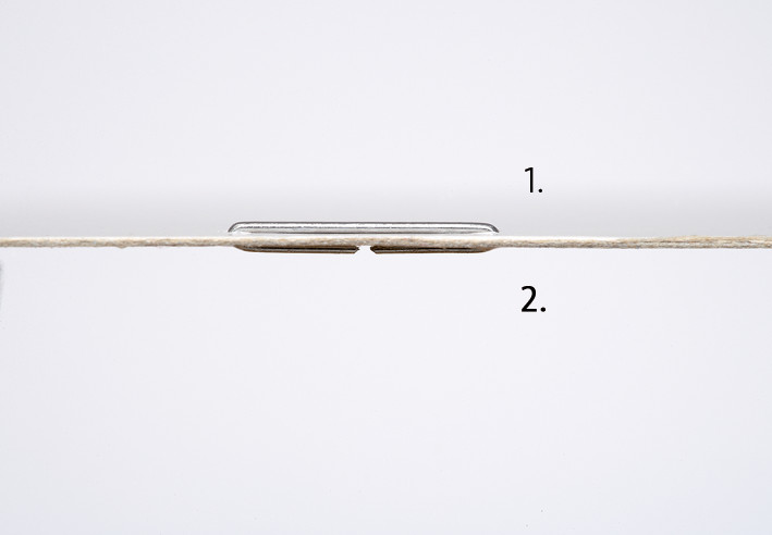 With the two-stage stapling action, the staple legs pierce the paper first. The staple ends are then bent over and pressed absolutely flat against the paper.