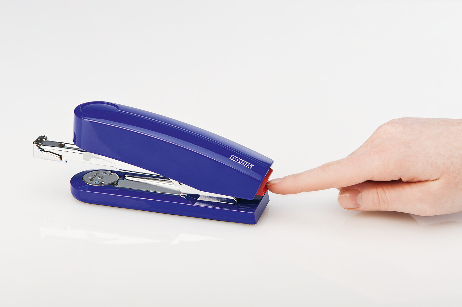 By pressing a button at the rear of the stapler, the staple magazine is released for front loading.